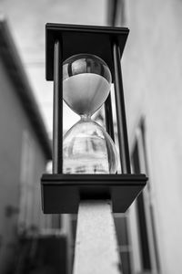 Close-up of clock on sand