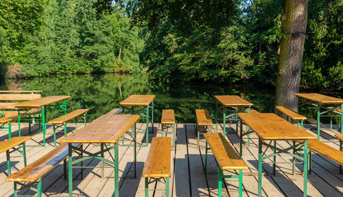 Empty chairs and table in park