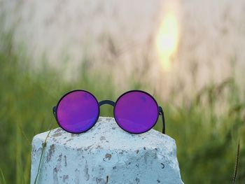 Close-up of multi colored sunglasses on land