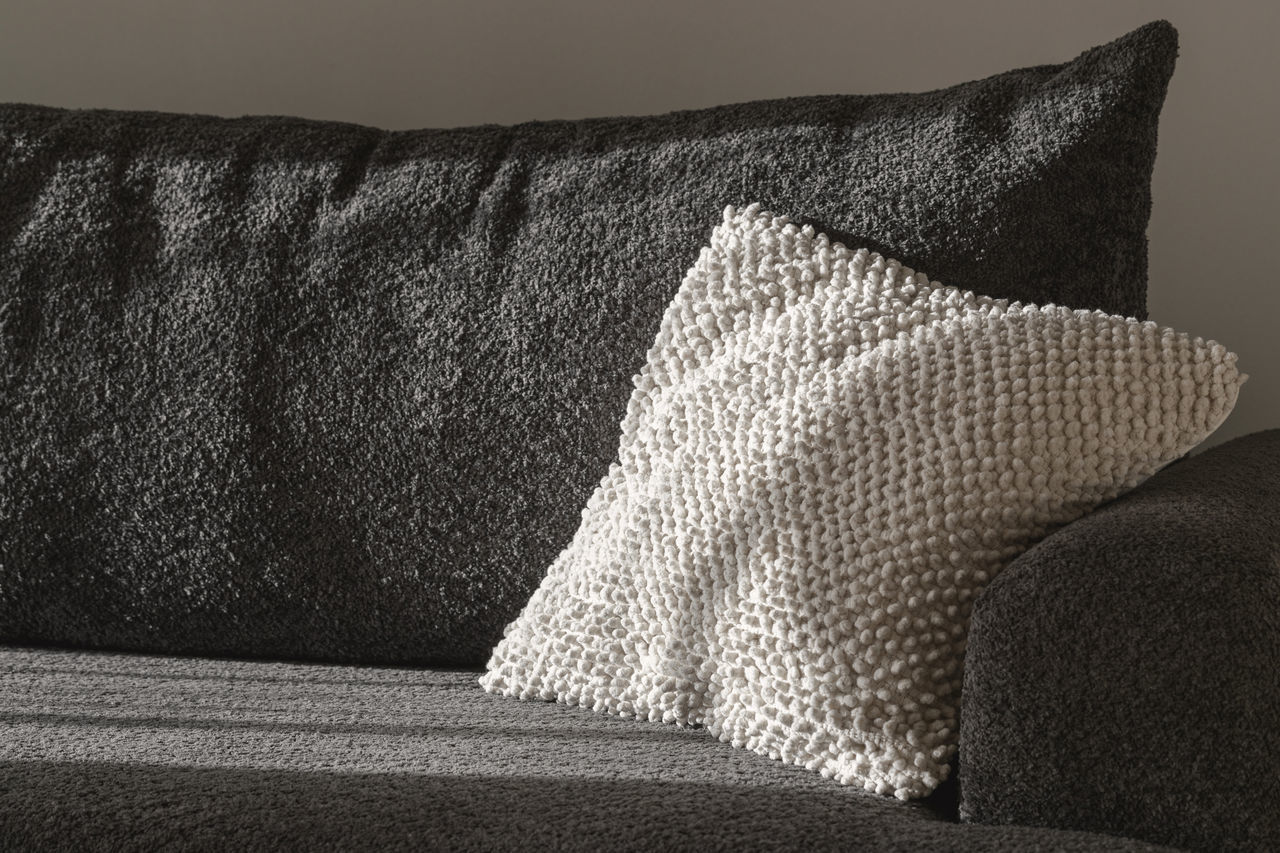 furniture, black, pillow, sofa, throw pillow, textile, couch, white, no people, indoors, black and white, cushion, monochrome, pattern, studio couch, monochrome photography
