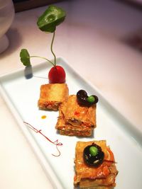 Close-up of served food in plate on table