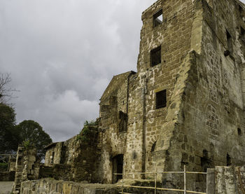 Low angle view of old building against sky