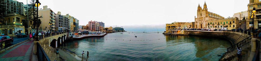 Panoramic view of city at waterfront