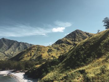 Air breeze on scenic view of raw of mountains against sky 