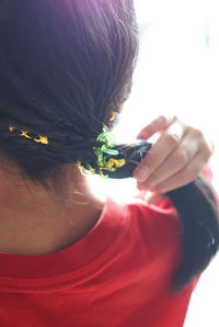 Close-up portrait of a girl holding camera