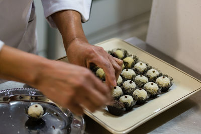 Close-up of hands  making desserts
