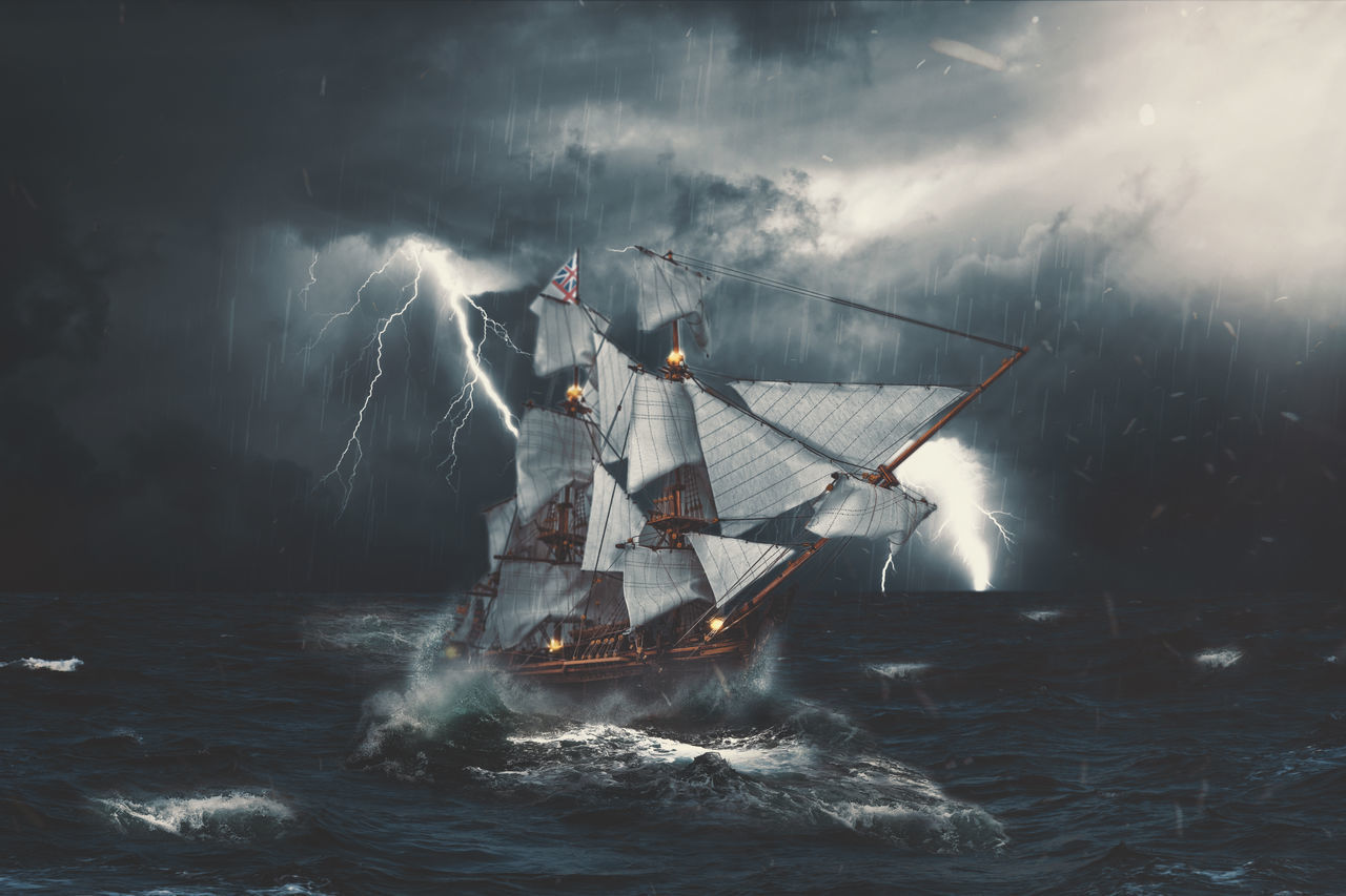 DIGITAL COMPOSITE IMAGE OF SAILBOAT IN SEA