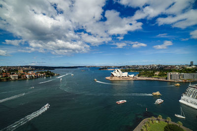 High angle view of sea and city against sky