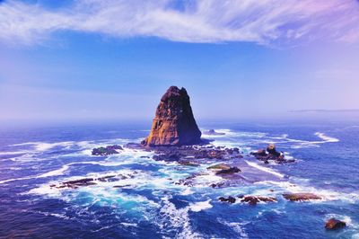 Scenic view of sea against blue sky