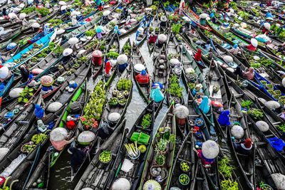 High angle view of boats on lake at market