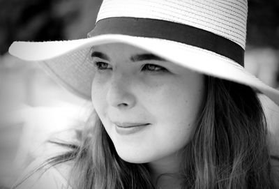 Close-up portrait of smiling young woman