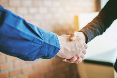 Cropped image of people shaking hands