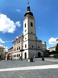 Street amidst buildings in city against sky