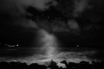 Scenic view of sea against sky at night