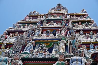 Low angle view of statue against building