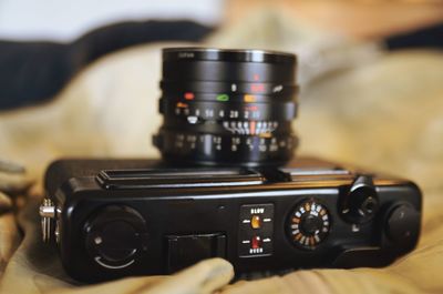 Close-up of camera on bed