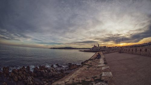 Scenic view of sea against cloudy sky