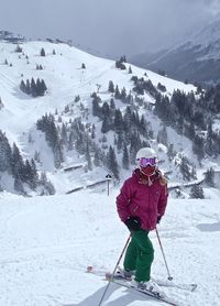 Single girl standing on skies