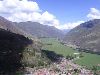 Scenic view of landscape and mountains against sky