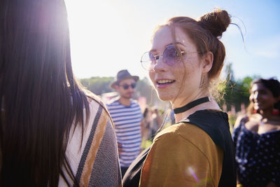 Smiling man and women enjoying in carnival