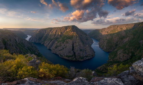 Panoramic view of mountains against sky during sunset