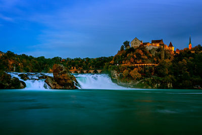 Long exposure photograph of the rhein falls with the laufen castle on the background.
