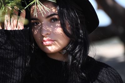 Portrait of woman outdoors in sunny day