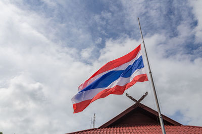 Low angle view of flag against sky
