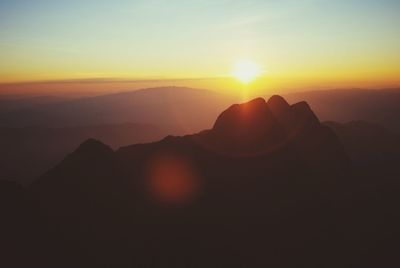 Scenic view of mountains at sunset