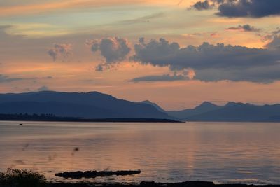 Scenic view of sea against orange sky sunrise 