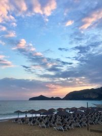 Scenic view of beach against sky during sunset