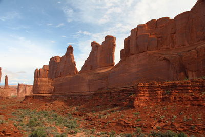 Rock formations at temple against sky