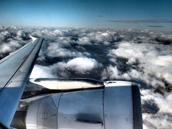 Cropped image of airplane flying over landscape