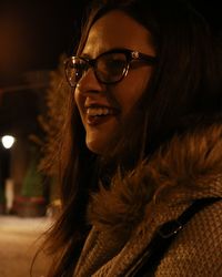 Close-up of smiling woman wearing eyeglasses