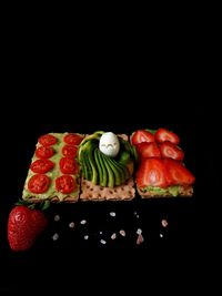 Close-up of fruits and vegetables against black background