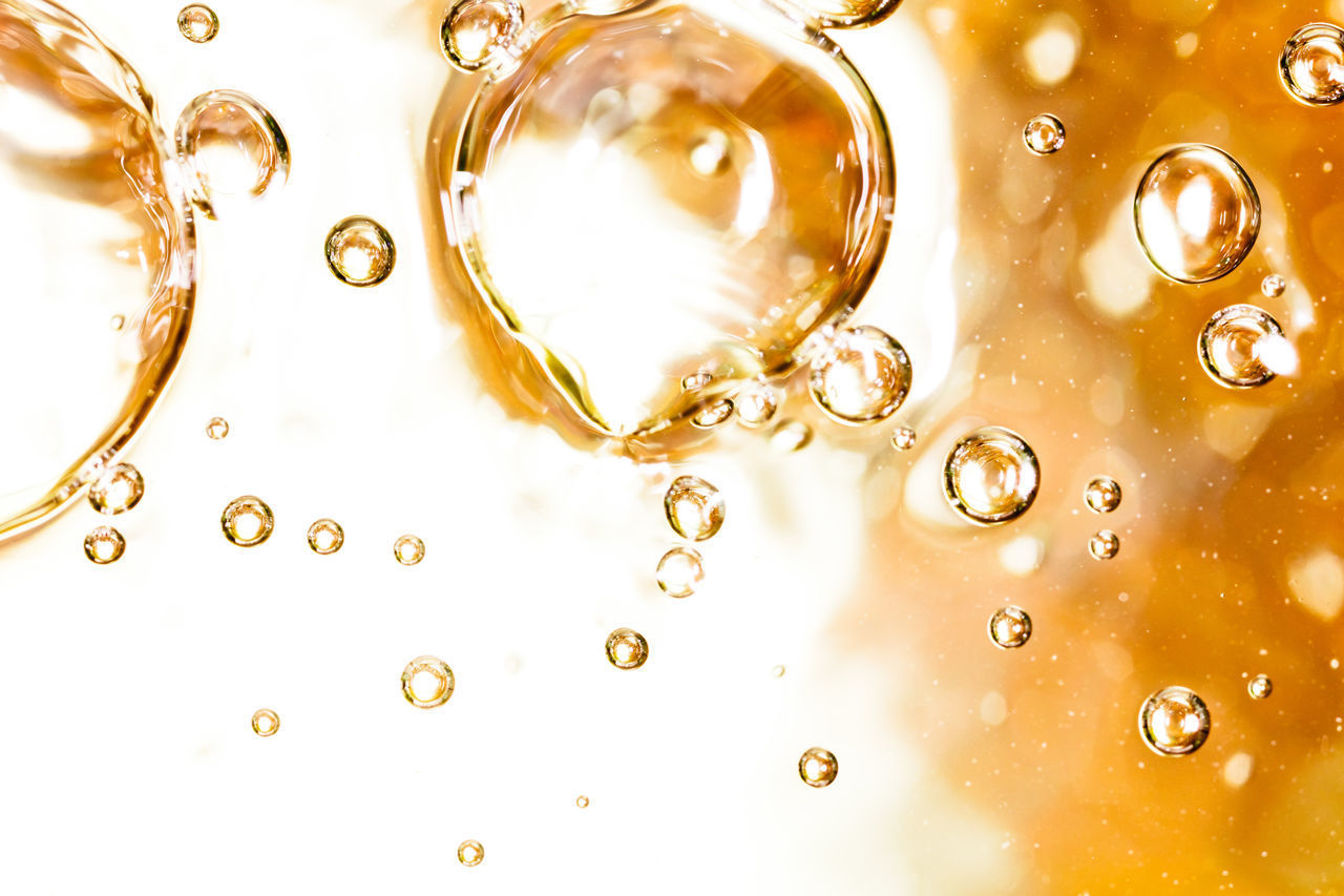 FULL FRAME SHOT OF WATER DROPS ON GLASS