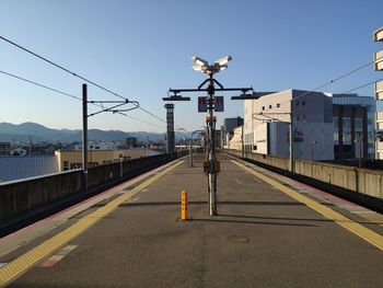 View of railroad station platform against clear sky