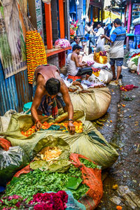 Group of people at market stall