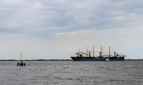 Ship in sea against sky