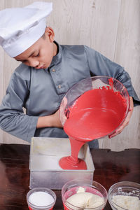 Boy preparing food in kitchen