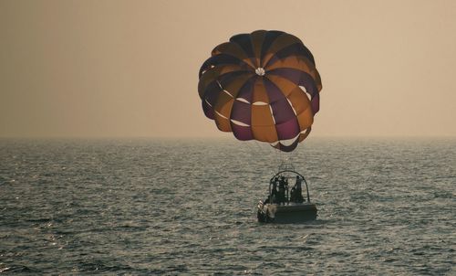 Lone boat in sea against clear sky