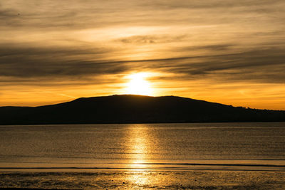 Scenic view of mountains against sky during sunset