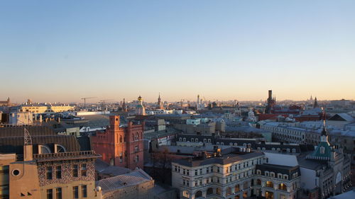 High angle view of city at sunset