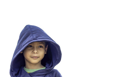 Portrait of boy against white background