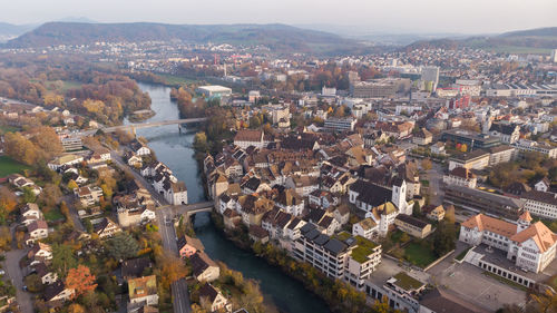 High angle view of river amidst buildings in town