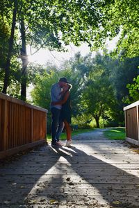Full length of man standing against trees