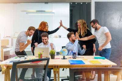 Group of business colleagues working at office