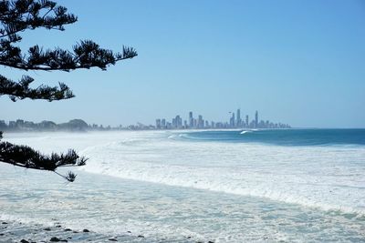 View of sea against clear blue sky