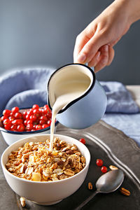 Close-up of hand holding bowl