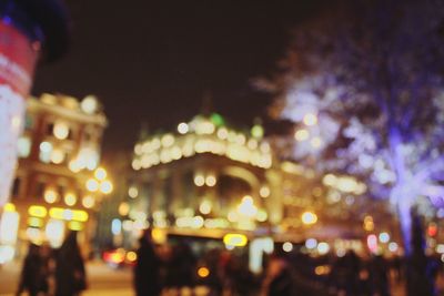 Defocused image of illuminated city at night